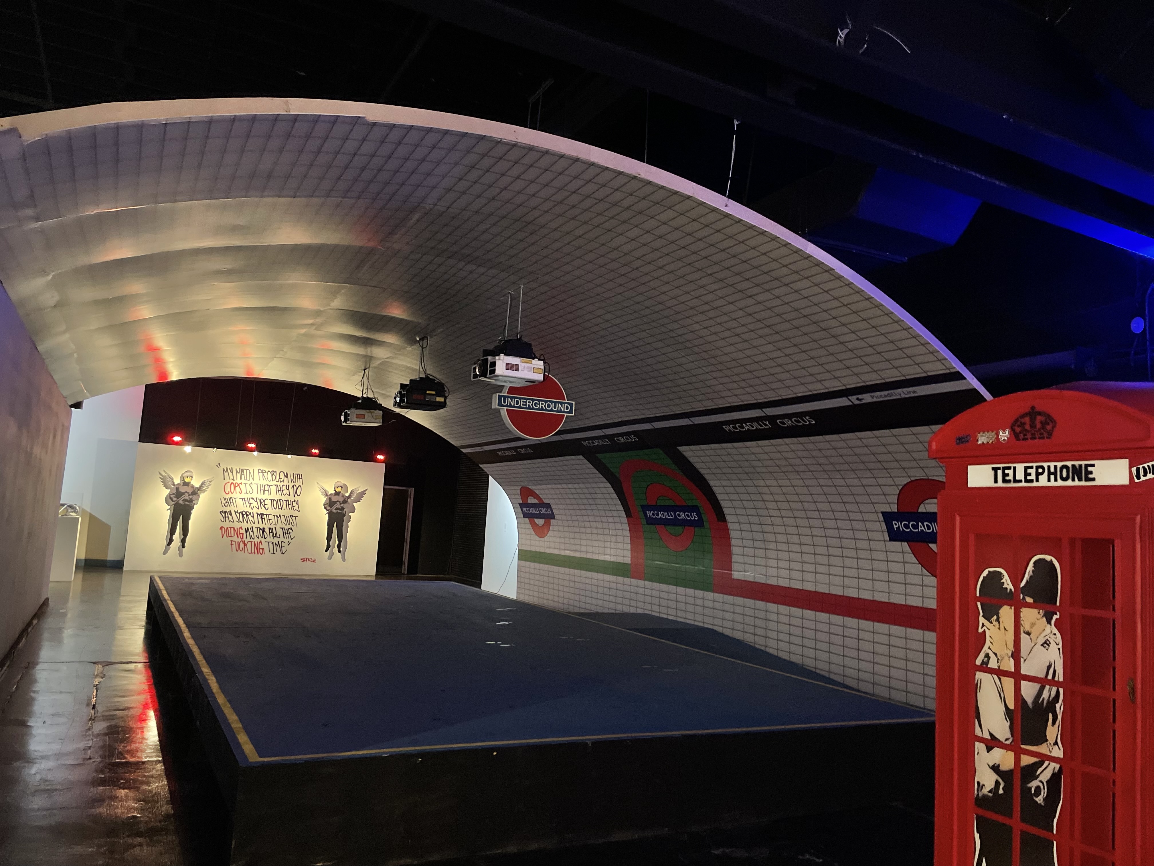 Art of Banksy exhibit - London Underground station replica with telephone booth