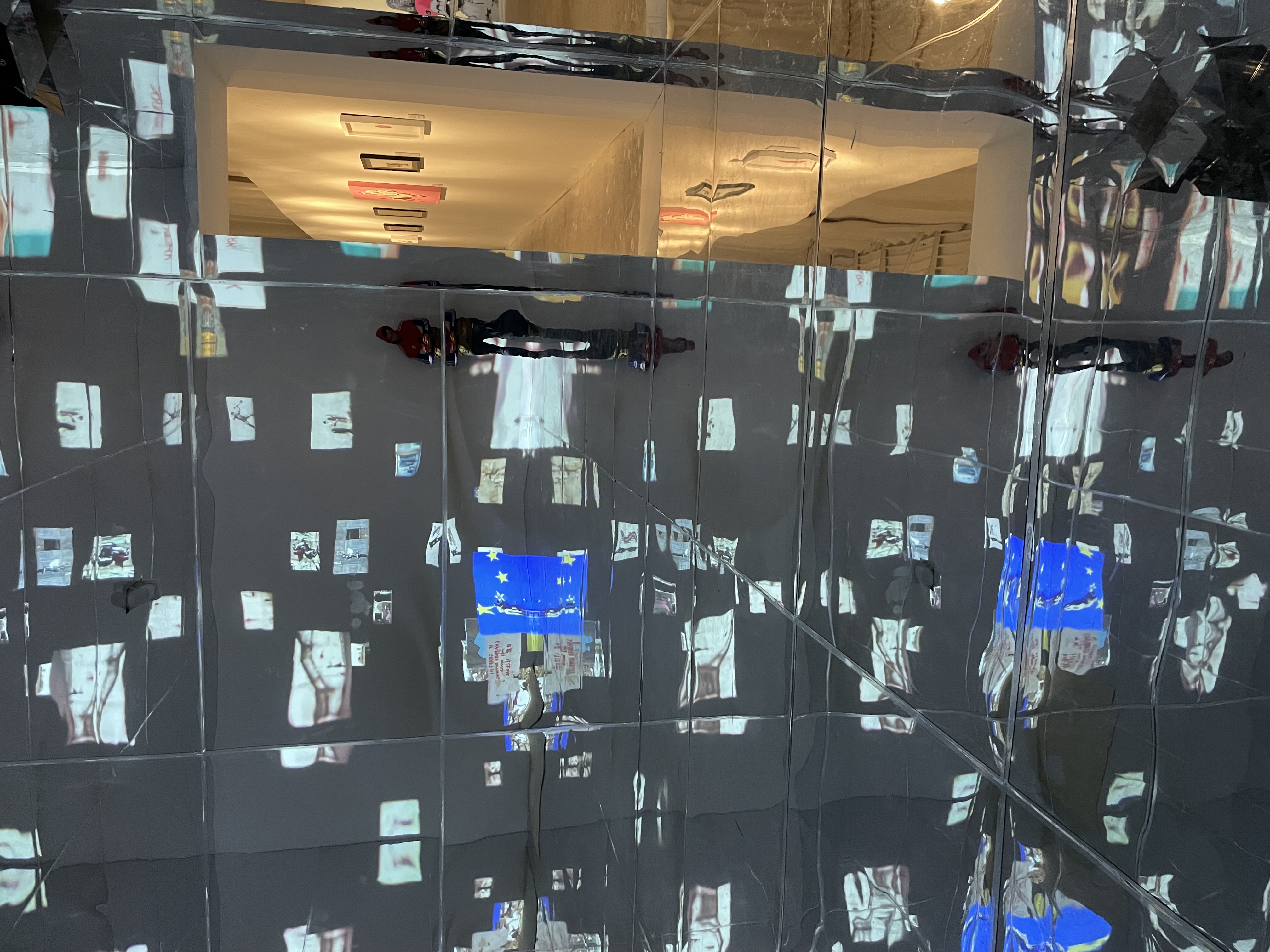 Art of Banksy exhibit - Mirrored room reflecting projected images and art
