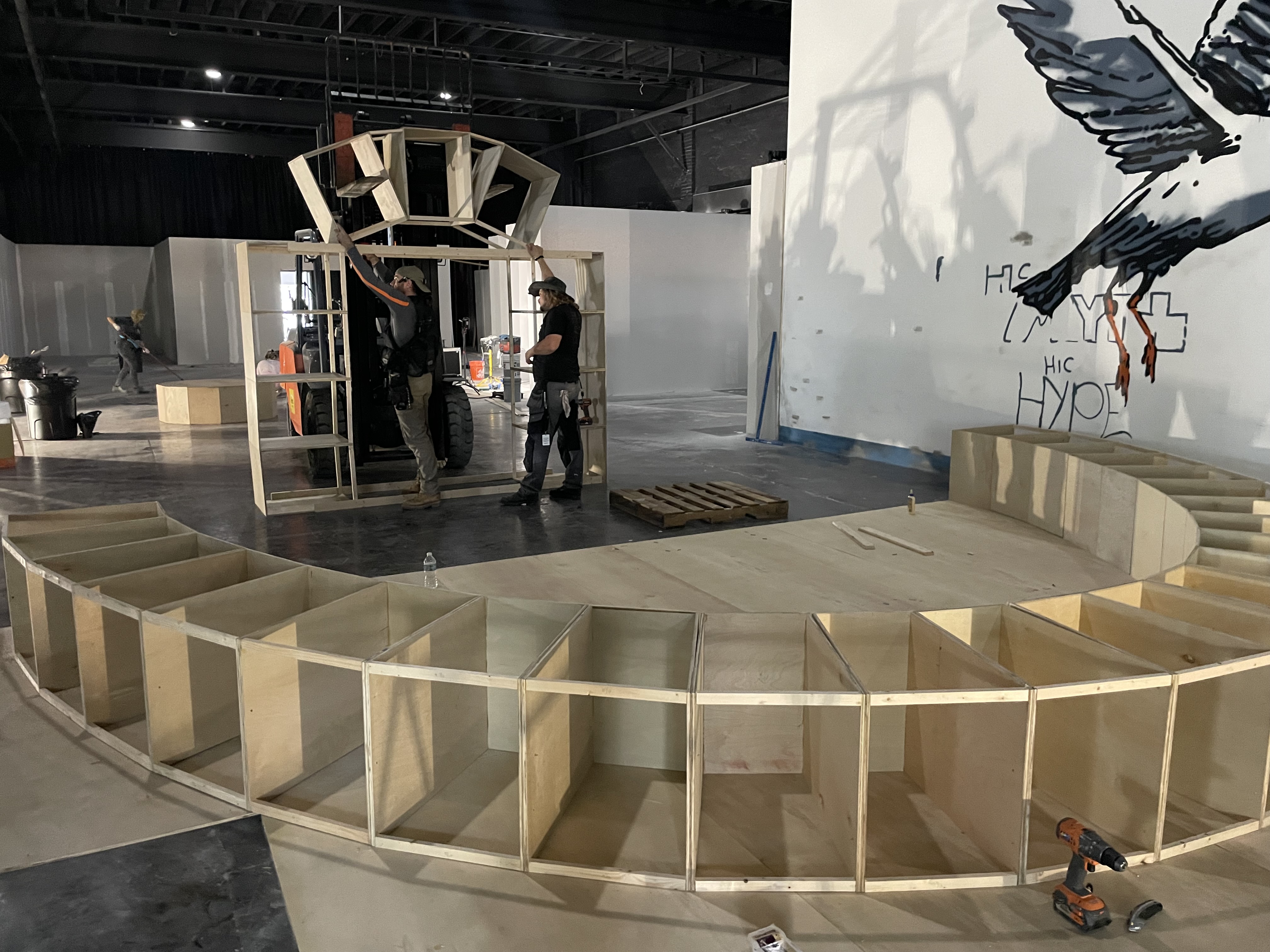 Art of Banksy exhibit - Wooden framework construction of a circular display area