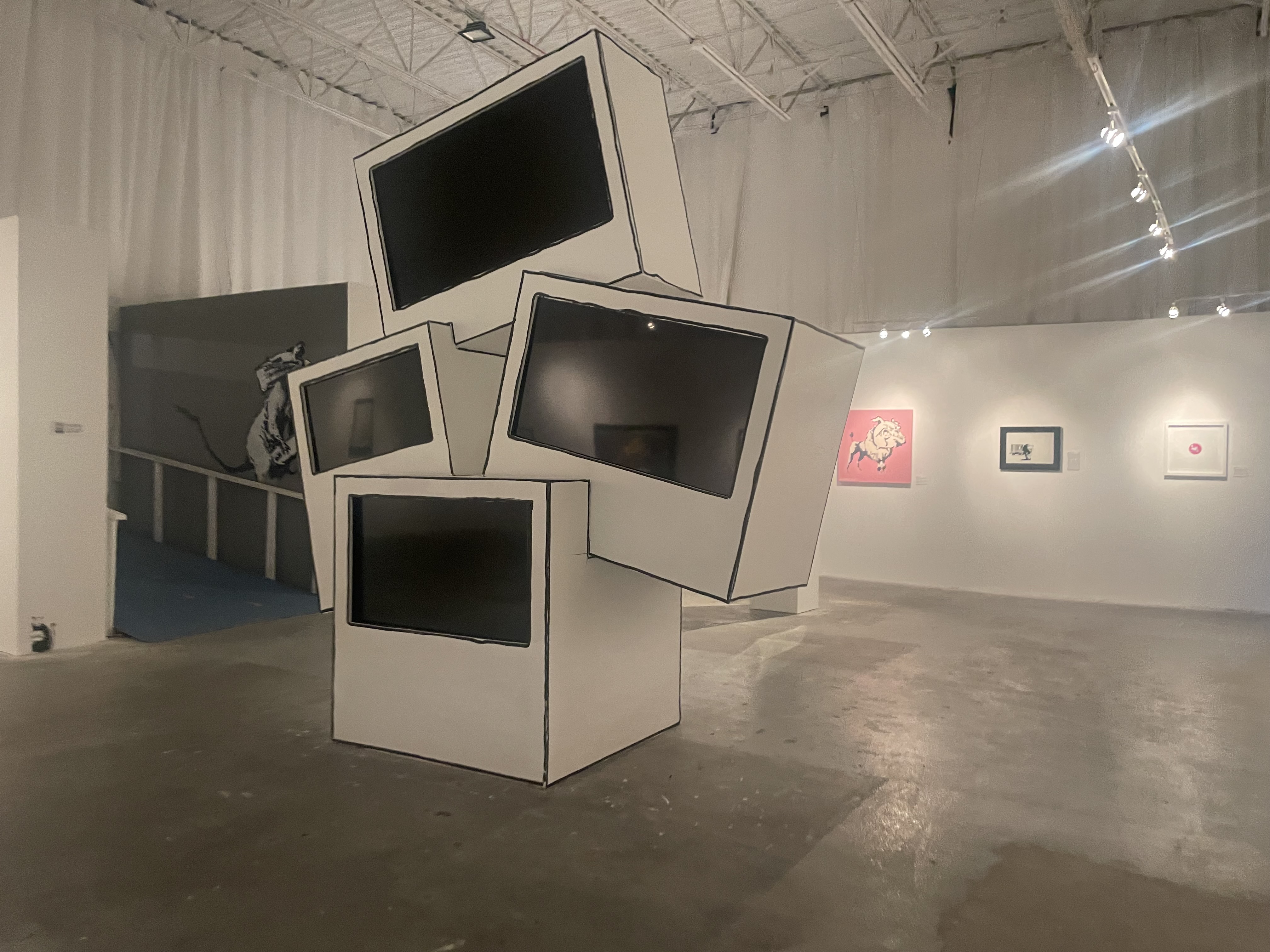 Art of Banksy exhibit - Sculpture of stacked, oversized 2D-style computer monitors